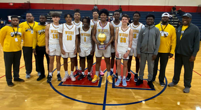Winter Haven poses with its Kingdom in the Sun championship trophy on Saturday at the Kingdom in the Sun Tournament at Vanguard High School in Ocala. It was the Blue Devils second consecutive tournament trophy.